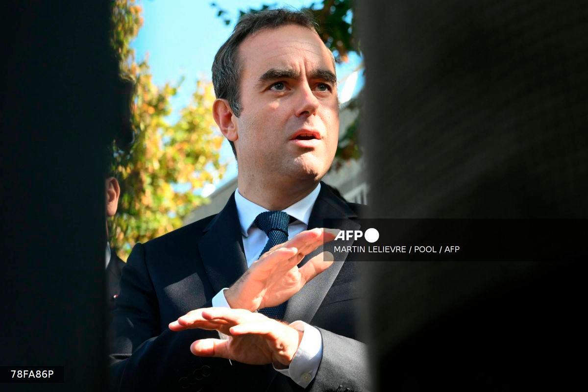 France's Prime Minister Sebastien Lecornu speaks to journalists after a visit to a police station in L'Hay-les-Roses, on the southern outskirts of Paris on October 11, 2025. - POOL via AFP