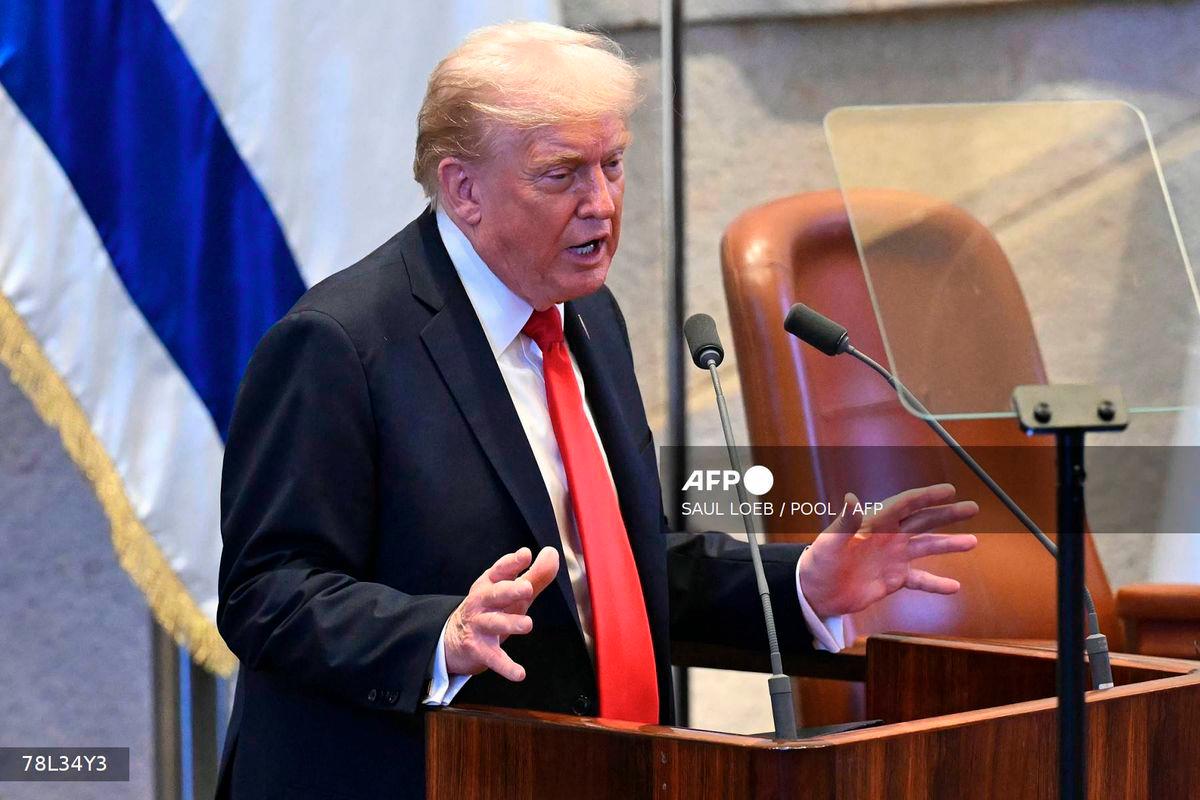 US President Donald Trump addresses the Israeli parliament, the Knesset, in Jerusalem on October 13, 2025. - POOL via AFP