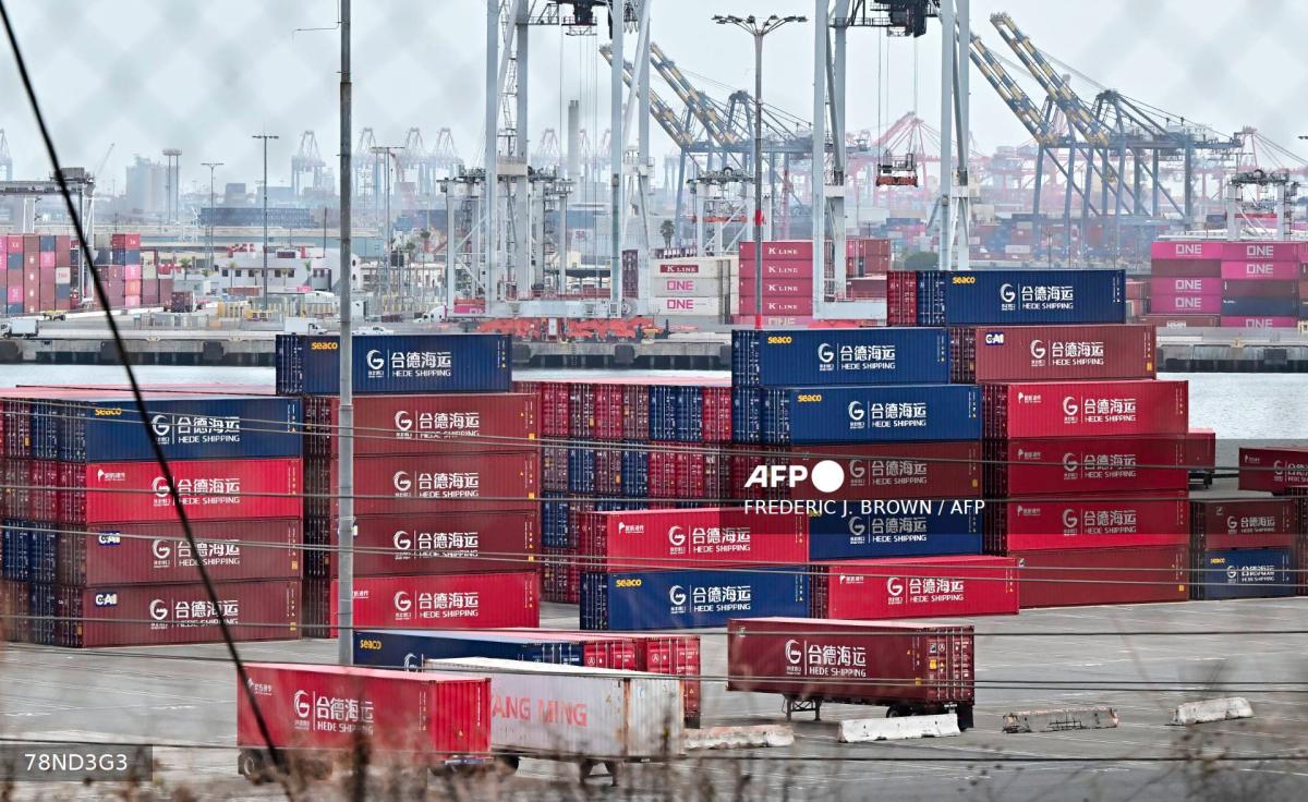 Shipping containers from Hede Shipping, from the Chinese state-owned Hebei Port Group, are seen stacked at the Port of Los Angeles in Los Angeles, California on October 13, 2025. - AFPPIX