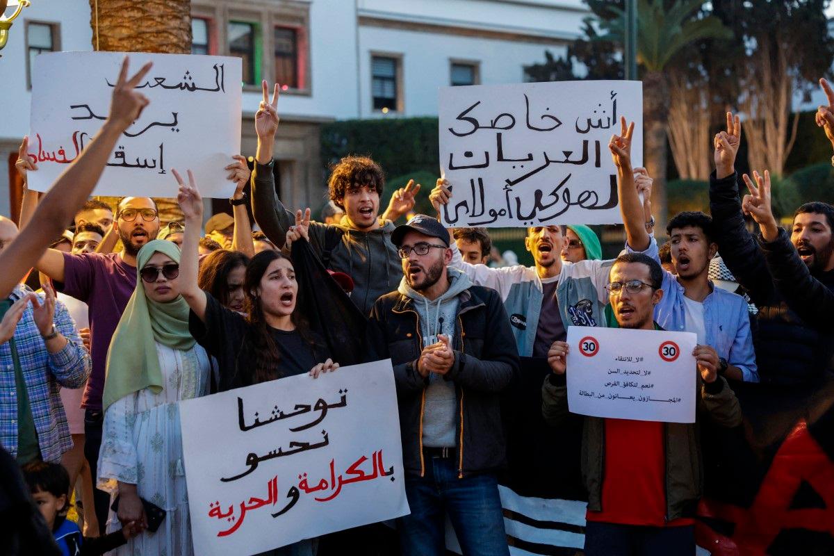 People take part in a youth-led demonstration demanding reforms to public healthcare and education in front of the parliament in Rabat on October 18, 2025. - Abdel Majid BZIOUAT / AFP