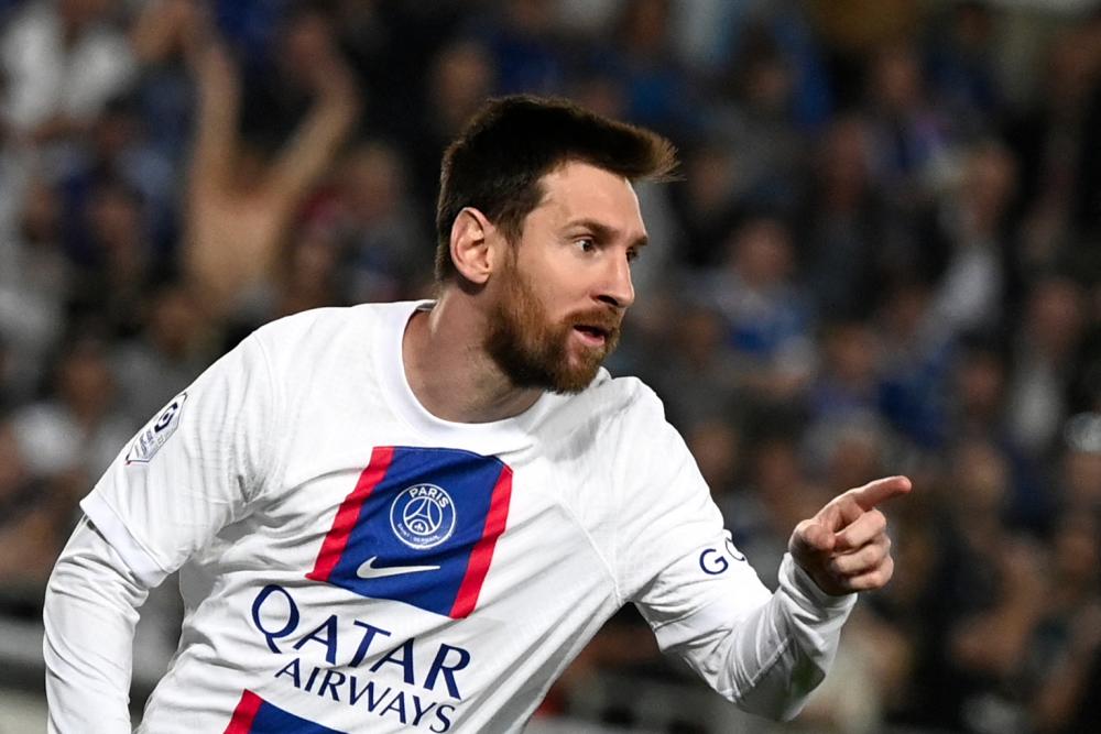 Paris Saint-Germain's Argentine forward Lionel Messi celebrates scoring his team's first goal during the French L1 football match between RC Strasbourg Alsace and Paris Saint-Germain (PSG) at Stade de la Meinau in Strasbourg, eastern France on May 27, 2023. - AFPPIX