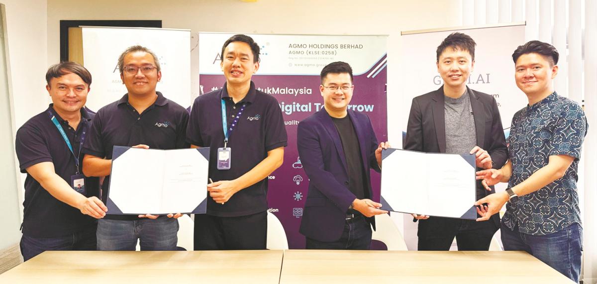 From left: Agmo CTO Tham Chin Seng, COO Steven Low Kang Wen, Tan, Tay and InfinitiLab CTO Alvin Chua and chairman Advent Phang.