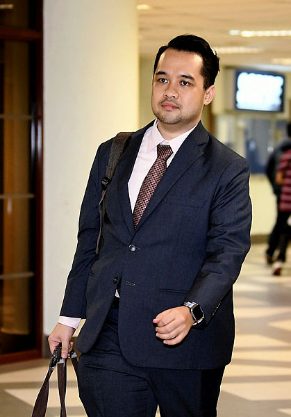 BNM manager Ahmad Farhan Sharifuddin arrives at the trial of former prime minister Datuk Seri Najib Abdul Razak’s case involving RM42 million in misappropriated funds from SRC International Sdn Bhd, at the Kuala Lumpur High Court on April 17, 2019. — Bernama