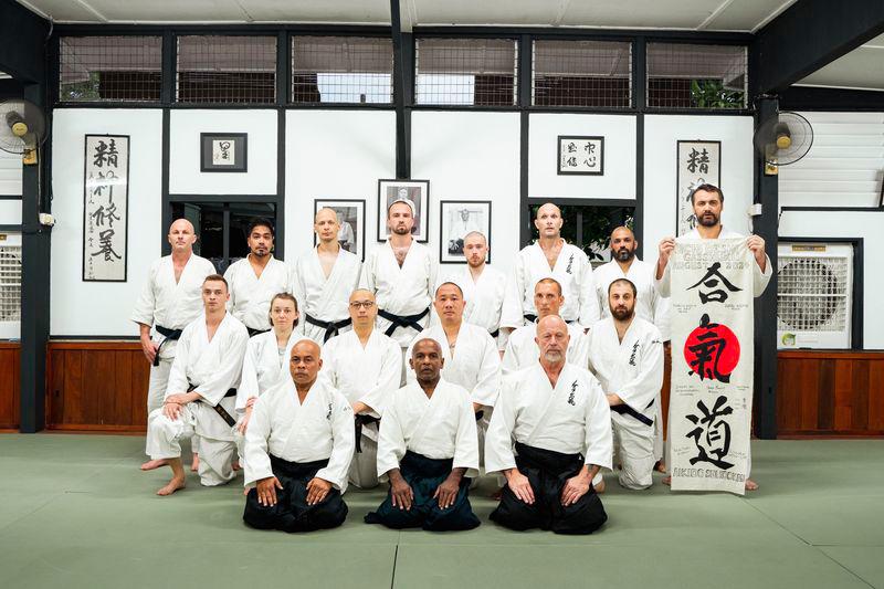 Joe Thambu Shuseki Shihan (first row, seated, centre), Chief Instructor of Aikido Shudokan International, together with Ramlan Ortega Shihan (first row, seated, left), Chief Instructor of Aikido Shudokan Malaysia, Ondra Musil Shihan (first row, seated, right), Instructor of Shikon Budokai Czech Republic, and the 14 participants who took part in the two-week immersive training camp called the Uchi Deshi Gasshuku held at The Shudokan, Seremban.