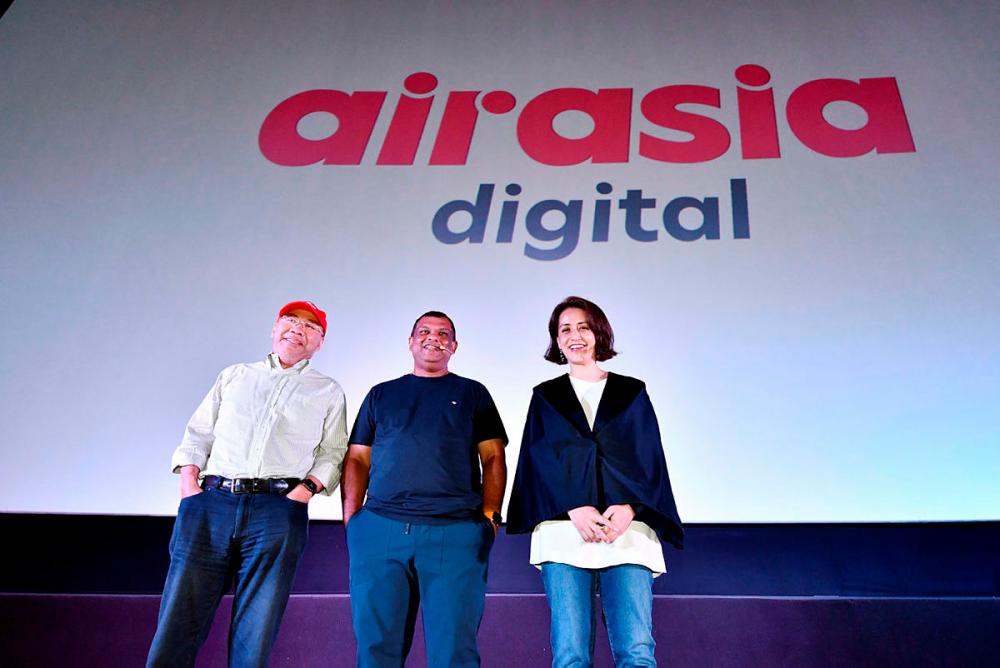 From left, AirAsia Group Executive Chairman Datuk Kamarudian Meranun, AirAsia Group Chief Executive Officer Tan Sri Tony Fernandes and AirAsia Group (AirAsia Digital) Aireen Omar are present at the AirAsia Digital briefing and press conference at the NU Sentral today.-Bernama