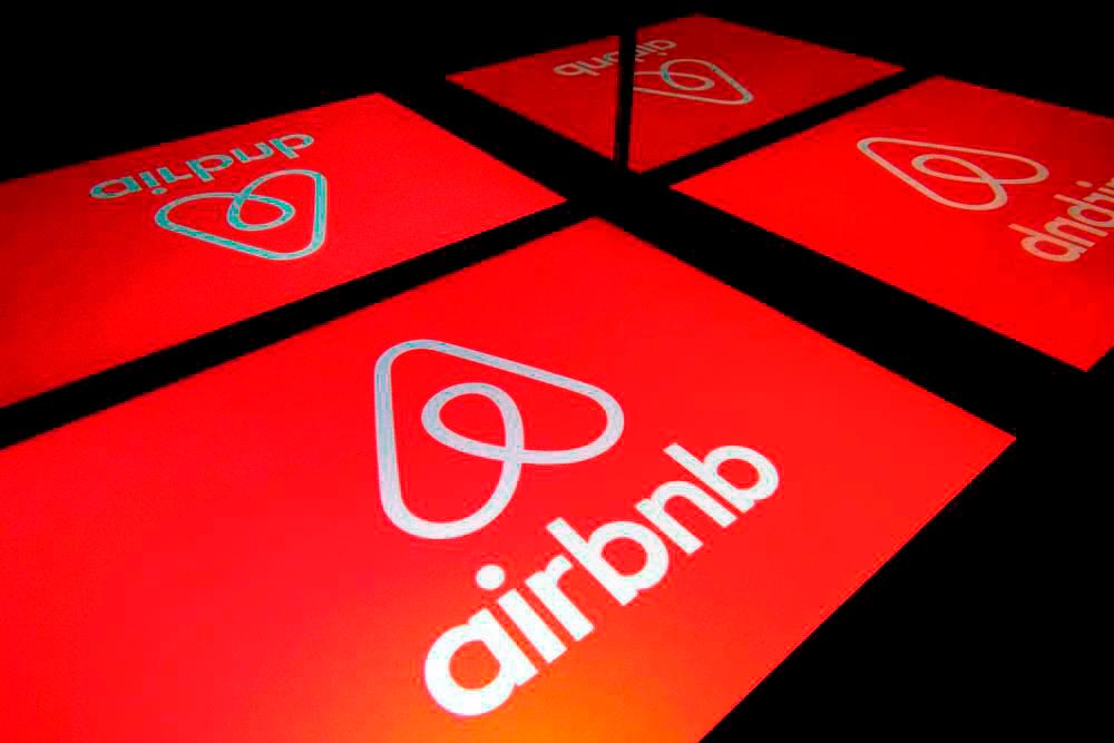 Illustration photo shows the logo of Airbnb displayed on a tablet. – AFPpix