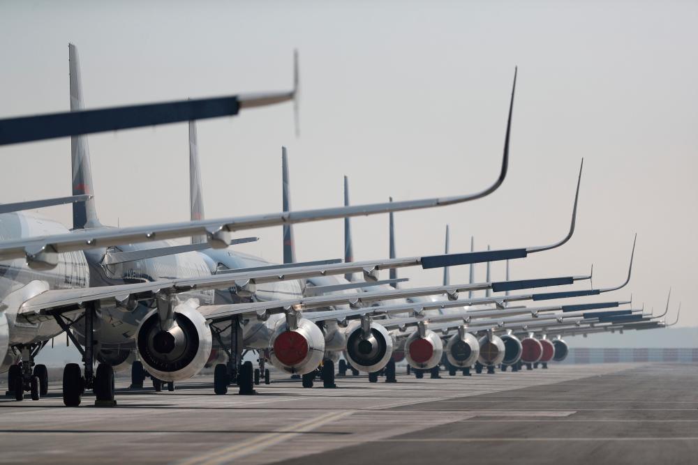 Passenger planes parked on a runway are seen during a general quarantine amid the spread of the coronavirus disease at the Arturo Merino Benitez International Airport, in Santiago, Chile. – REUTERSPIX