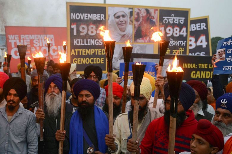 Activists of the Dal Khalsa radical Sikh organisation march at a protest to commemorate the 1984 anti-Sikh riots in Amritsar, India, on Nov 3, 2018. — AFP