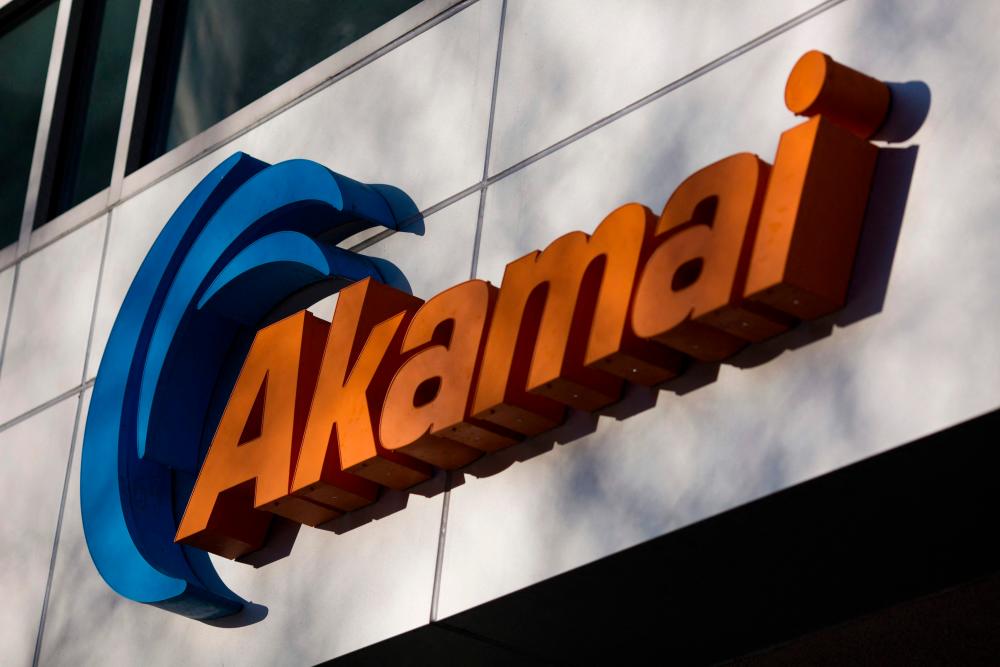 A sign for Akamai technology company on a building in Cambridge, Massachusetts. Akamai is one of the largest providers of content delivery network services. – AFPPIX