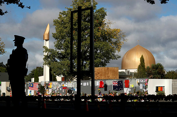 A police officer stands guard outside Al Noor mosque in Christchurch — Reuters