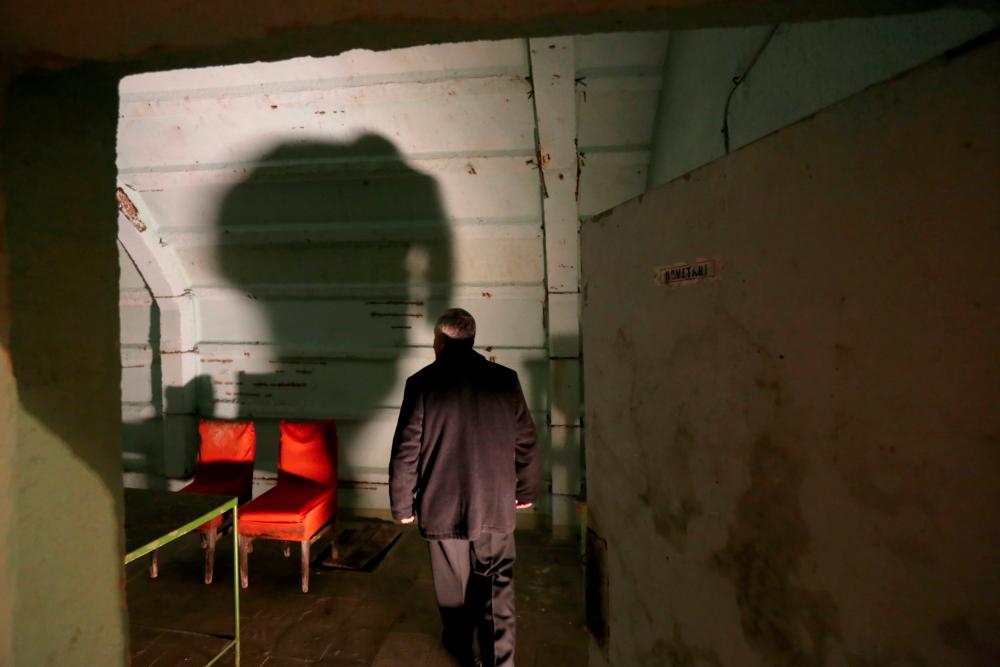 In this photograph taken on Feb 2, 2020, Astrit Imeri, a former soldier, walks inside The Cold War Tunnel Museum at Gjirokastra, Albania. — AFP