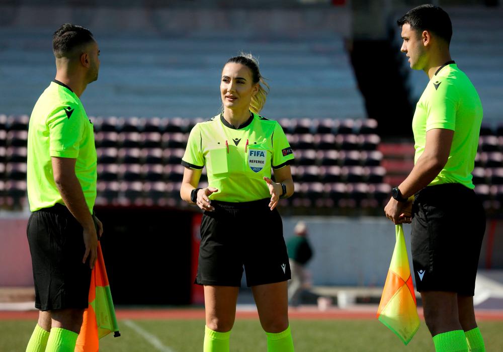 Referee Emanuela Rusta (C), chats with colleagues during a training session at the Elbasan Arena stadium, in Elbasan, central Albania, on February 13, 2023. AFPPIX