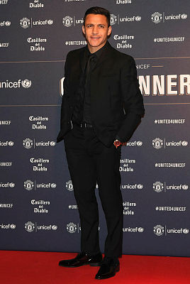 Manchester United’s Chilean striker Alexis Sanchez poses on the red carpet upon arrival to attend the “United for UNICEF Gala Dinner” at Old Trafford, Jan 22, 2019. — AFP