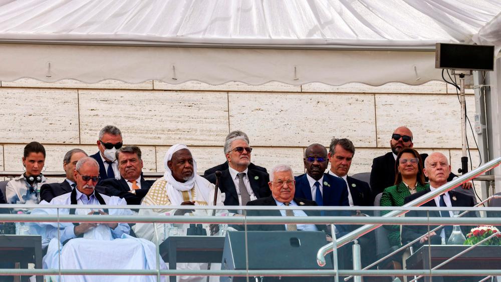 A handout picture provided by the Palestinian Authority’s press office (PPO) on July 5, 2022 shows Palestinian president Mahmud Abbas (C), Tunisian President Kais Saied (R), Libya’s Foreign Minister Najla el-Mangoush (R 2nd row), Syria’s Foreign Minister Faisal Mekdad (L 2nd row), and other foreign dignitaries attending Algeria’s 60th independence anniversary in its capital Algiers. AFPPIX