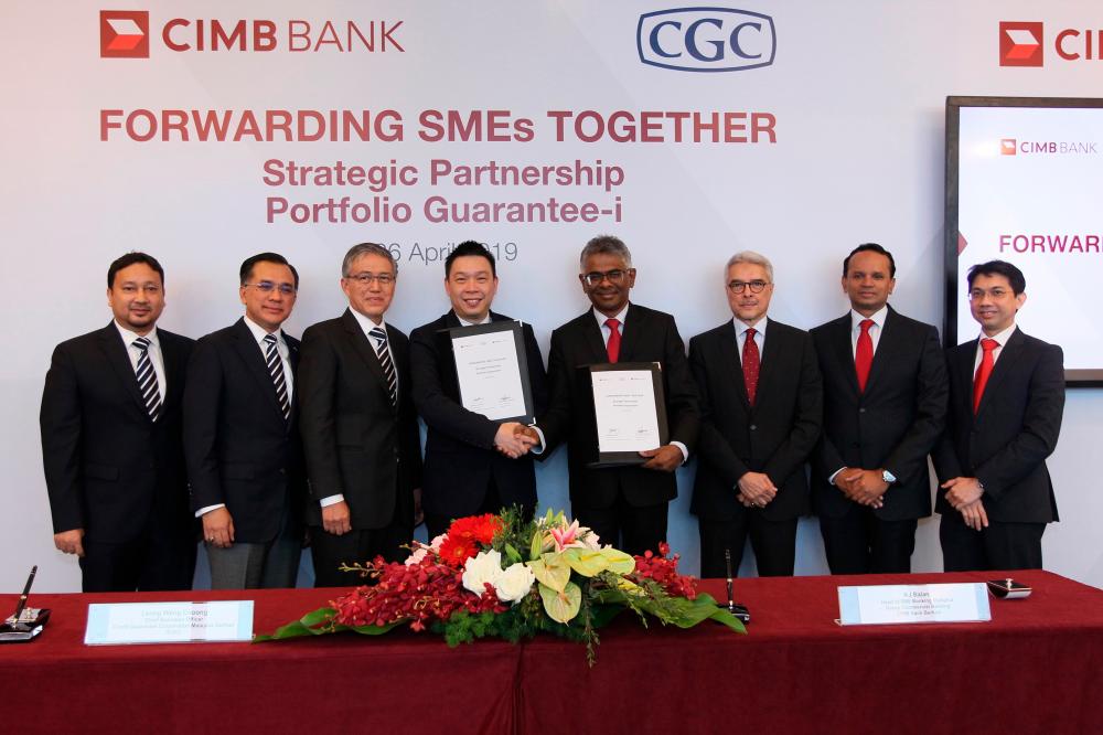 CIMB and CGC representatives at the signing ceremony