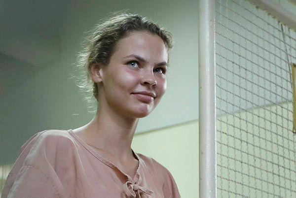 Picture shows detained Belarusian model Anastasia Vashukevich, preparing to board a prison van after a court trial in Pattaya, following a police raid on a sex training course. — AFP