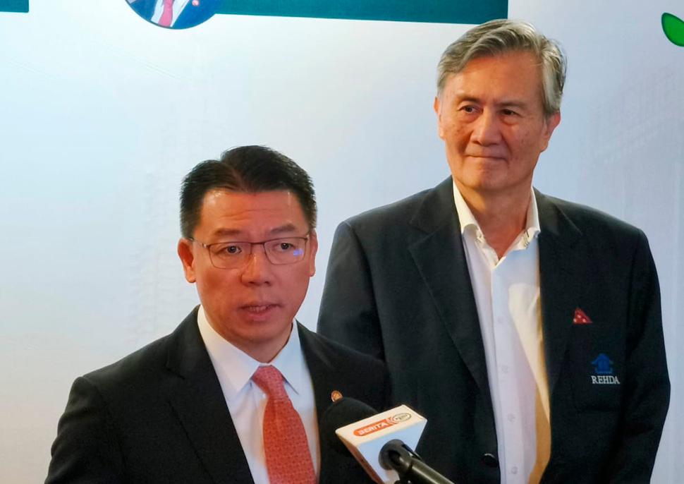 Nga speaking at a press conference at the International Green Build Conference 2025 today. On the right is Rehda Institute chairman Datuk Jeffrey Ng.