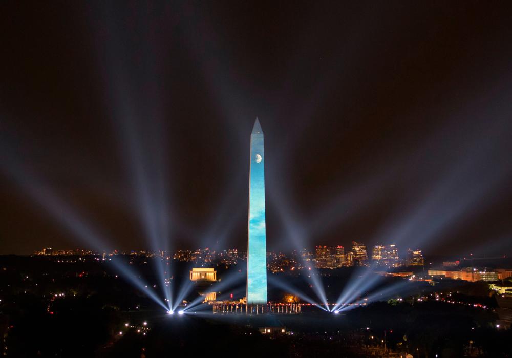 This handout photo released by Nasa shows the 50 year anniversary of the Apollo 11 mission being celebrated in the ‘Apollo 50: Go for the Moon’ show, which combined full-motion projection-mapping artwork on the Washington Monument and archival footage to recreate the launch of Apollo 11, July 19, 2019 in Washington, DC. - AFP
