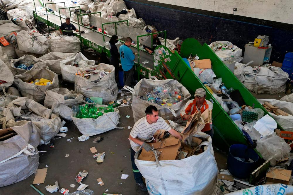 View of “cartoneros” (garbage recyclers) working at the “Cooperativa Construyendo Desde Abajo” in San Justo, La Matanza, Buenos Aires province, taken on October 5, 2023. AFPPIX