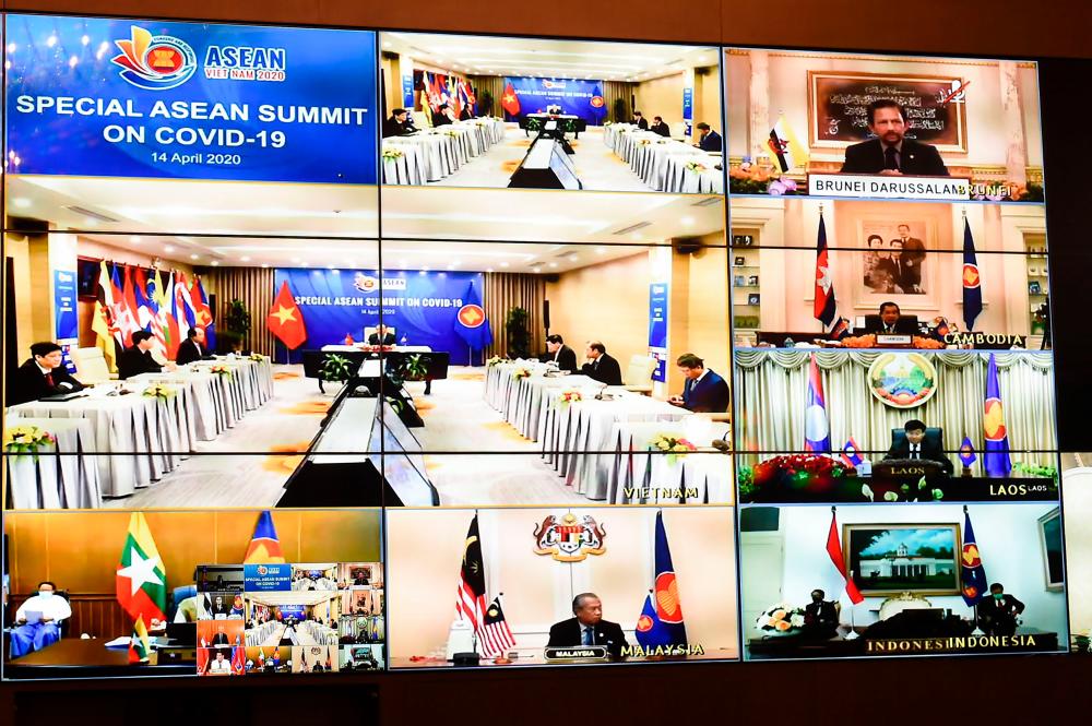 Handout photo taken and released today by the Thai government shows multiple screens of live video conference for the special Asean summit, that was being held in Hanoi, on the Covid-19 coronavirus pandemic. – AFP/THAI GOVERNMENT