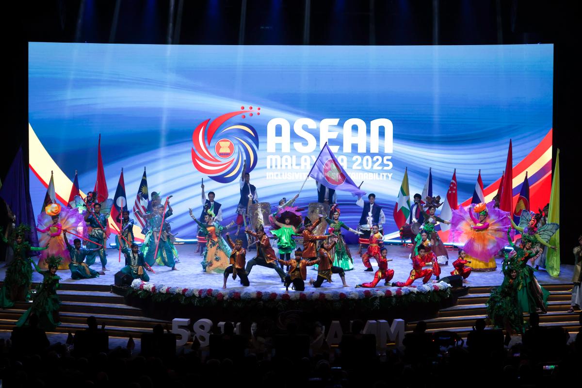 Performers bearing Asean flags pose in conjunction with the 58th Asean Foreign Ministers' Meeting and Related Meetings at the Kuala Lumpur Convention Centre on Wednesday. An economist says Malaysia must consistently support multilateral institutions over the long term and needs to do more to integrate Asean economies, even on a bilateral basis. – Bernamapic