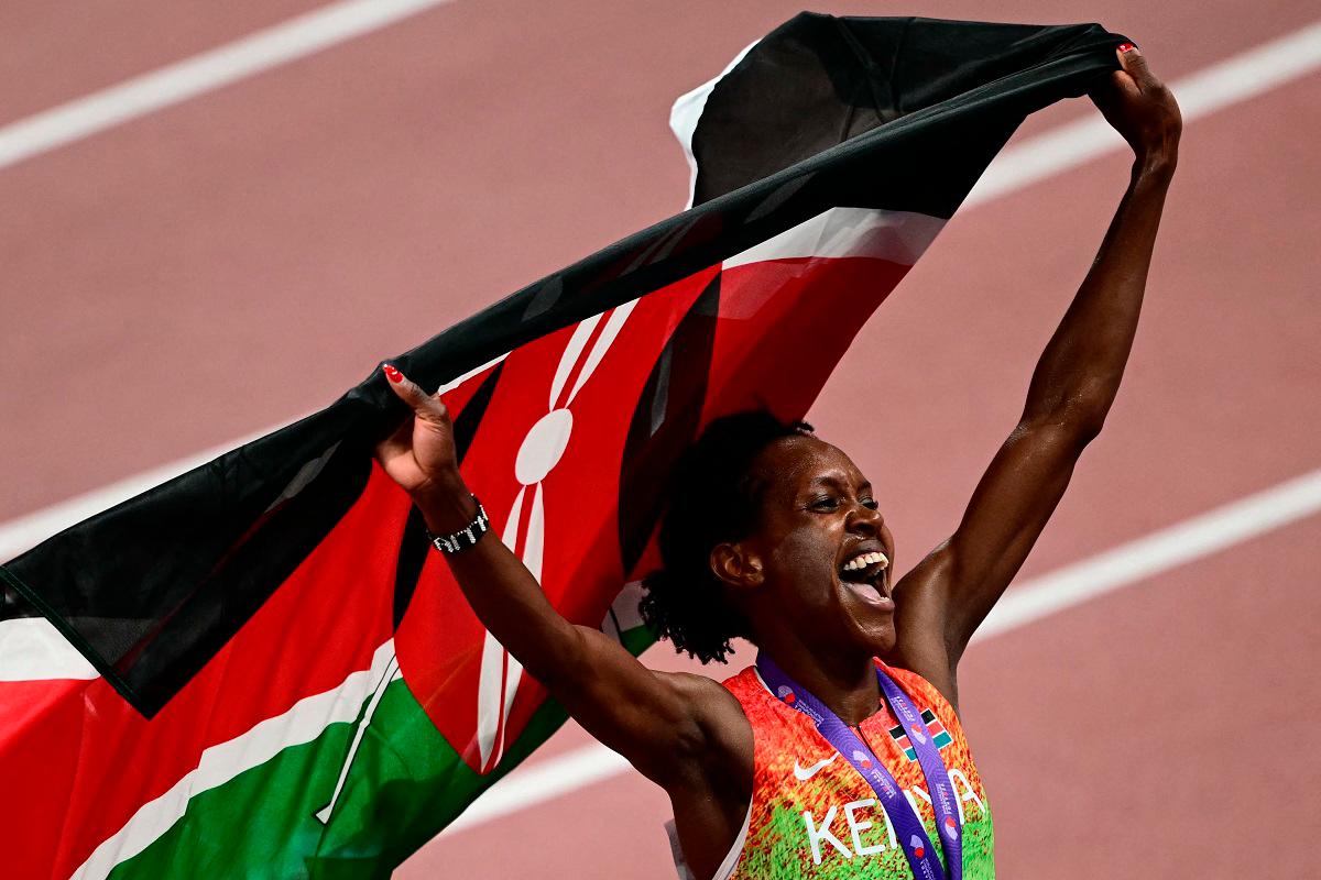 Kenya’s Faith Kipyegon celebrates after winning the women’s 1500m final. - Yuichi YAMAZAKI / AFP