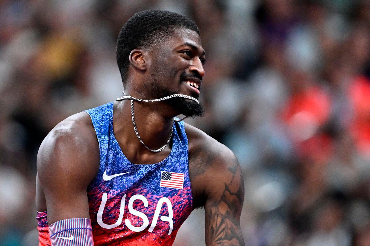 US’ athlete Cordell Tinch celebrates after winning the men’s 110m hurdles final. - Jewel SAMAD / AFP