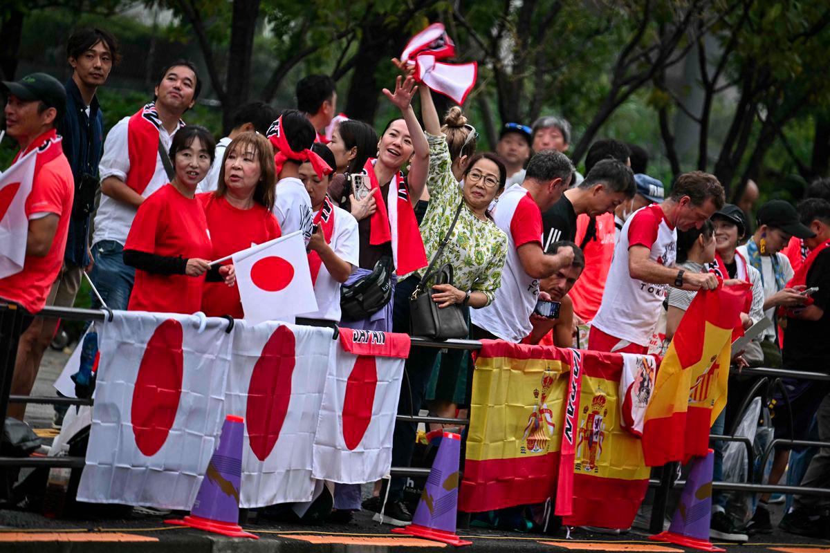 Supporters of Japan abd Spain gather ahead of the 35km race walk finals during the World Athletics Championships in Tokyo on September 13, 2025. - AFPPIX