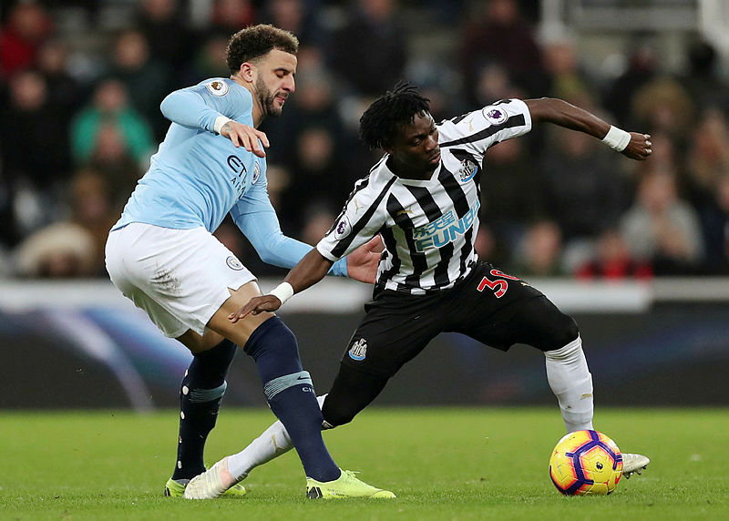 Christian Atsu of Newscastle United is challenged by Manchester City’s Kyle Walker, during their Premier League match at St James’ Park, on Jan 29, 2019. — AFP
