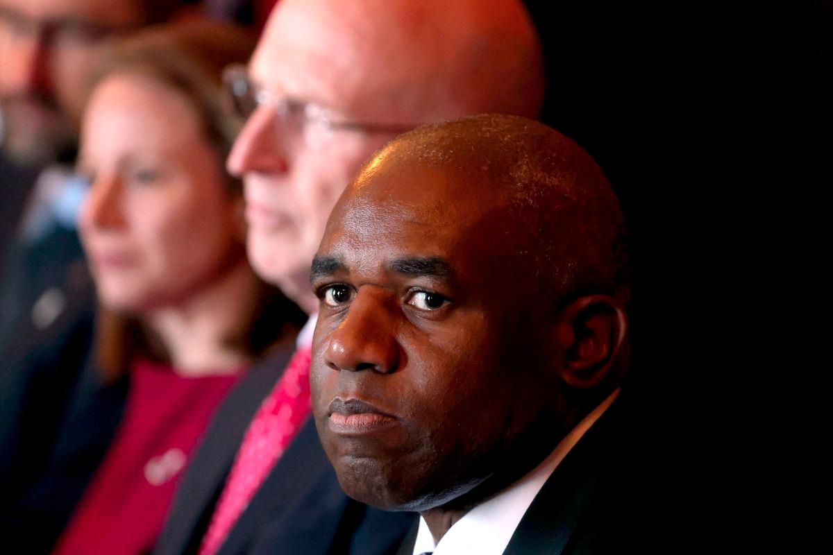 Britain’s Foreign Secretary David Lammy (R) reacts as he sits with Britain’s Defence Secretary John Healey (C) and other officials during the Australia-UK Ministerial Consultations (AUKMIN) meeting in Sydney on July 25, 2025. - AFPPIX
