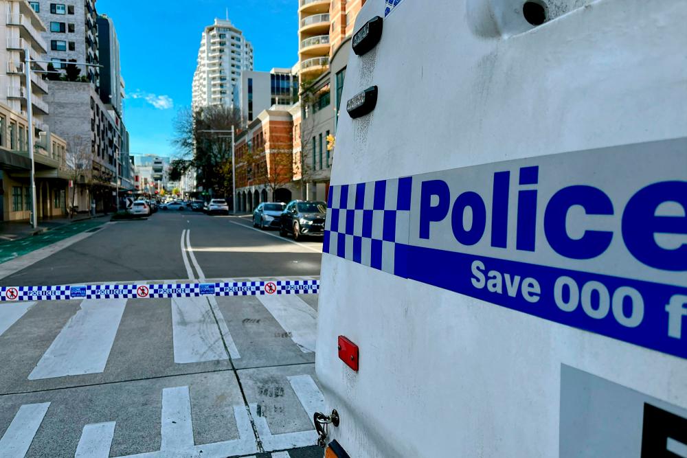 Police block off a street at Bondi Junction, an eastern suburb of Sydney on June 27, 2023 after a suspected shooting incident//AFPix