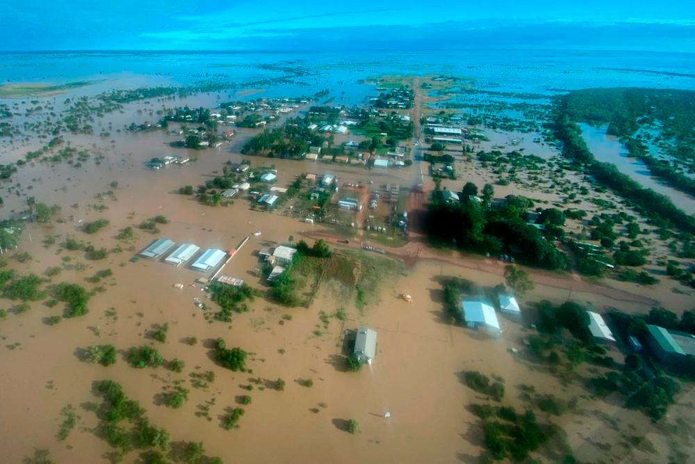 This handout photo taken on March 10, 2023 and received on March 11, 2023 from the Queensland Police Service shows an aerial view of the flooded northern Queensland town of Burketown/AFPPix