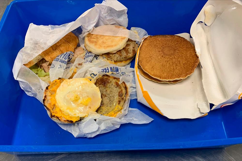 This undated handout photograph released by Australia’s Ministry of Agriculture on August 1, 2022 shows McDonald’s breakfast food items seized by Australian border guards from a traveller arriving from Indonesia, as part of strict biosecurity laws upon entering the country, at Darwin airport/AFPPix