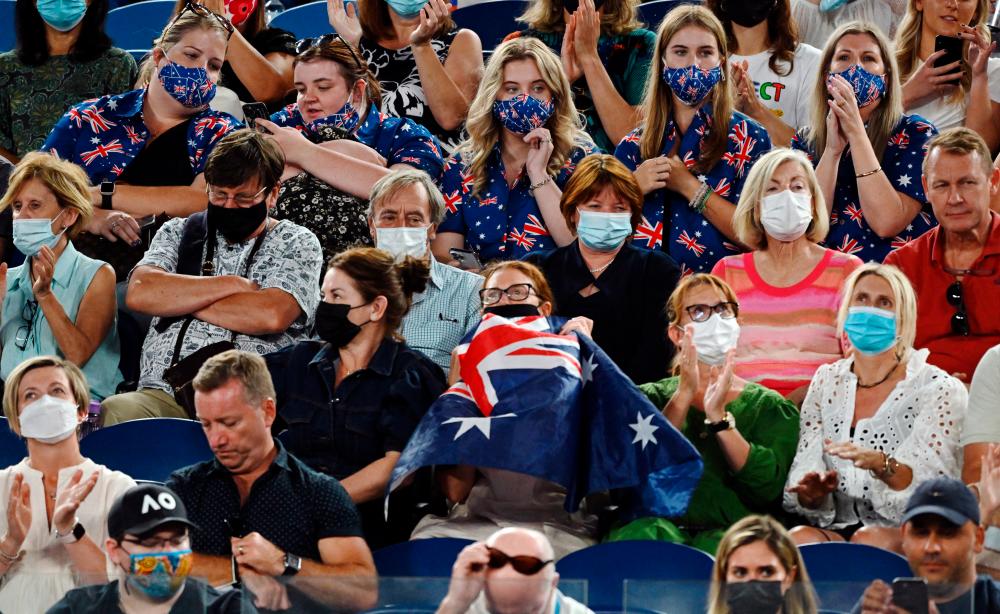 General view as spectators wearing a protective face masks during the Australian Open tennis tournament in Melbourne January 21,2022. REUTERSpix