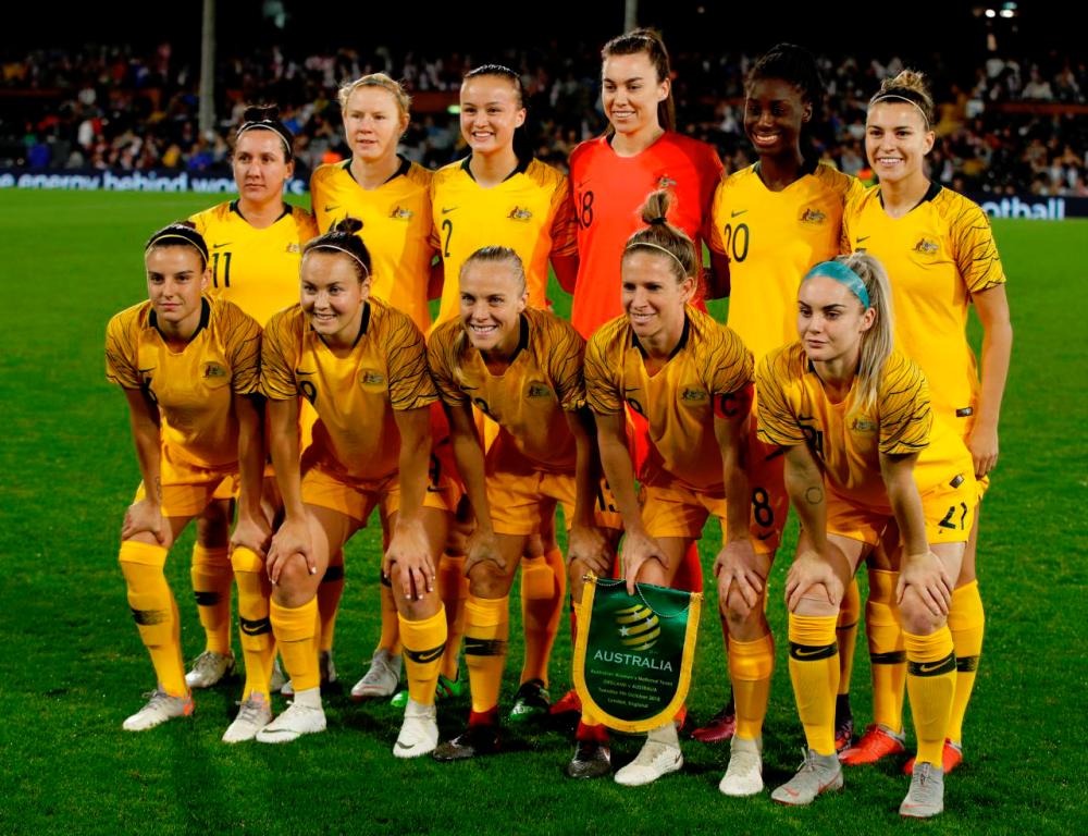 Australian players pose for a team group photo before the match — Reuters