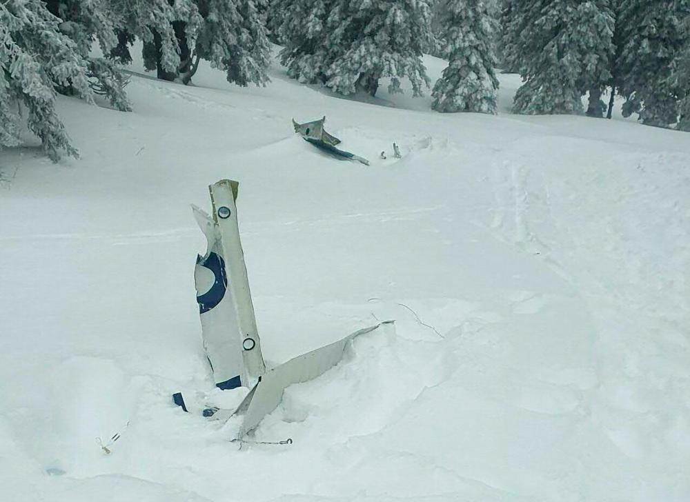 This photo taken on November 25, 2023 shows plane debris of a small plane that crashed at Kasberg Mountain, Gruenau im Almtal, Upper Austria. - AFPPIX