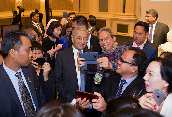 Prime Minister Tun Dr Mahathir Mohamad meets with Malaysians living in Austria and Slovakia during an event in Vienna on Monday, Jan 21, 2019. — Bernama