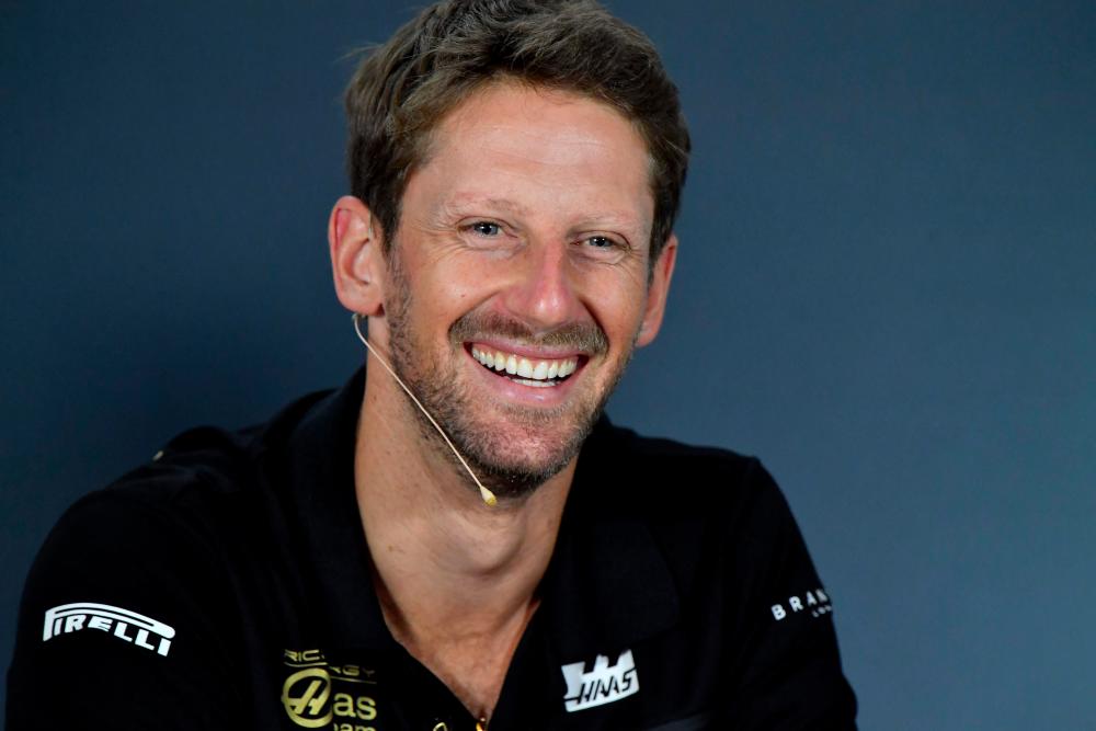 Haas F1’s French driver Romain Grosjean smiles during the driver’s press conference ahead of the Formula One Hungarian Grand Prix at the Hungaroring circuit in Mogyorod near Budapest, Hungary, on August 1, 2019. — AFP