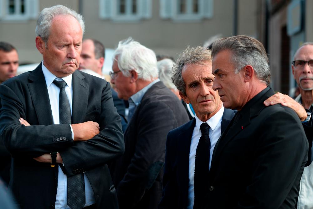 French President of Renault Sport F1 Jerome Stoll, Retired French F1 racing driver and Renault special advisor Alain Prost, Former Formula One Jean Alesi, waits for the funeral ceremony of the late French racing driver Anthoine Hubert’s outside the Cathedral of Notre Dame, on September 10, 2019, in Chartres, center France. — AFP
