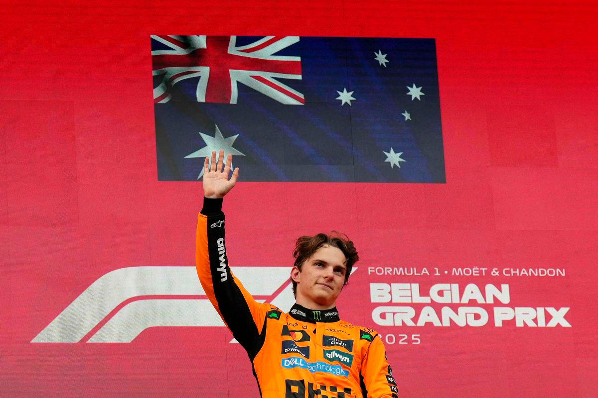 Winner McLaren’s Australian driver Oscar Piastri waves on the podium after the Formula One Belgian Grand Prix at the Spa-Francorchamps circuit in Spa, on July 27, 2025 - Photo by Dimitar DILKOFF / AFP