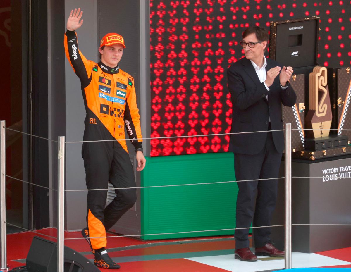Catalan regional president Salvador Illa (R) looks at McLaren’s Australian driver Oscar Piastri waving from the podium after winning the Formula One Spanish Grand Prix at the Circuit de Catalunya in Montmelo, on the outskirts of Barcelona, on June 1, 2025. AFPpix