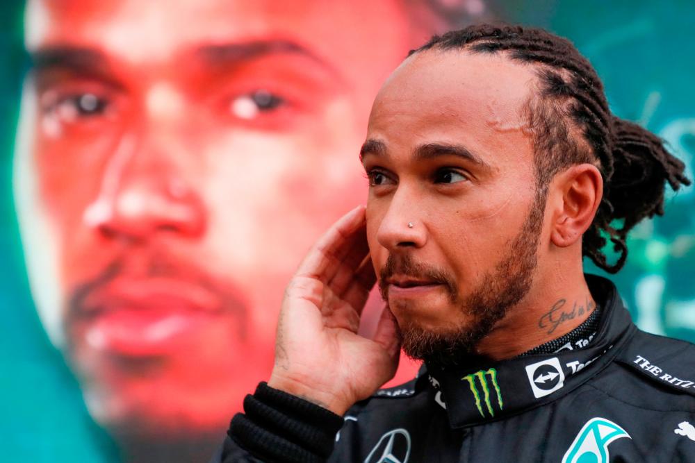 Mercedes’ British driver Lewis Hamilton celebrates after winning the Formula One Russian Grand Prix at the Sochi Autodrom circuit in Sochi on September 26, 2021. AFPPix