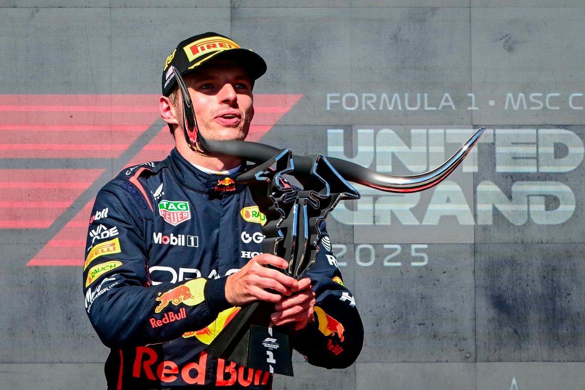 Red Bull Racing’s Dutch driver Max Verstappen hoists the trophy on the podium after winning the United States Formula One Grand Prix at the Circuit of the Americas in Austin, Texas, on October 19, 2025. - Jim WATSON / AFP