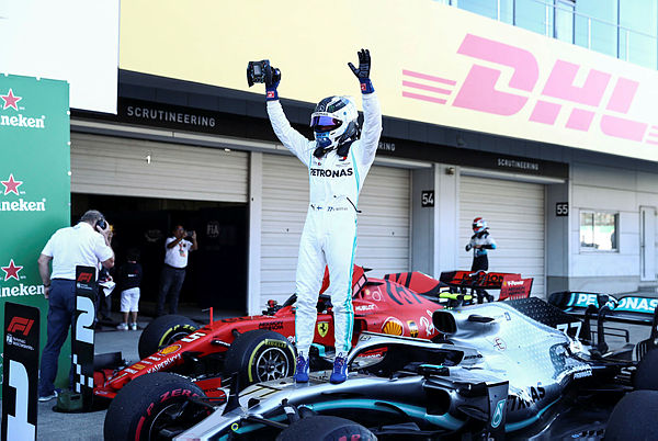 Mercedes’ Finnish driver Valtteri Bottas celebrates his victory at the end of the Formula One Japanese Grand Prix final at Suzuka on October 13, 2019. — AFP