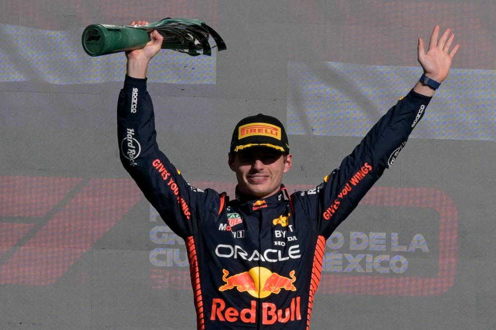 Red Bull Racing’s Dutch driver Max Verstappen celebrates on the podium after winning the Formula One Mexico Grand Prix at the Hermanos Rodriguez racetrack in Mexico City on October 29, 2023/AFPPix