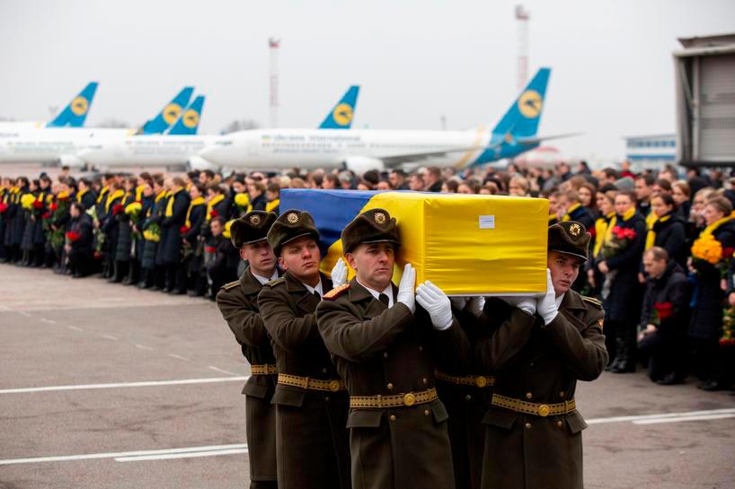 Soldiers carry a coffin containing the remains of one of the eleven Ukrainian victims of the Ukraine International Airlines flight 752 plane disaster during a memorial ceremony at the Boryspil International Airport, outside Kiev, Ukraine January 19, 2020. Ukrainian Presidential Press Service/Handout — Reuters