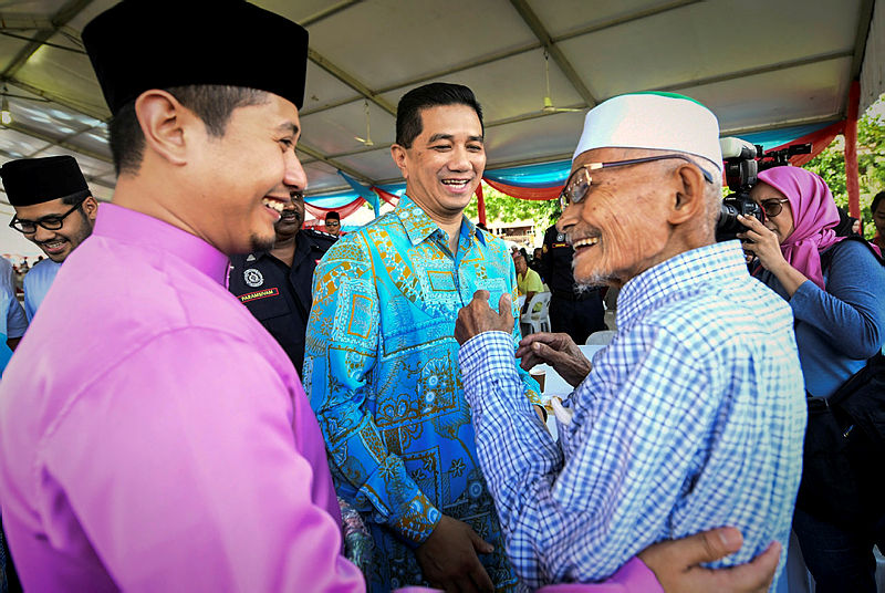 Datuk Seri Mohamed Azmin Ali is greeted by guests at a Hari Raya open house at his constituency in Gombak, on June 16, 2019. — Bernama