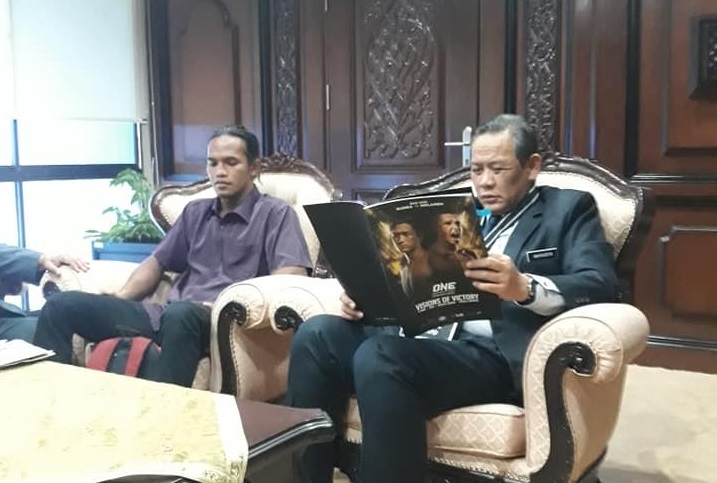 Muhammad Aiman (L) pictured here with Negri Sembilan Mentri Besar Aminuddin Harun