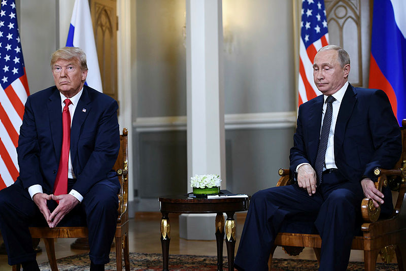Russian President Vladimir Putin (R) and US President Donald Trump attend a meeting in Helsinki, on July 16, 2018. - AFP