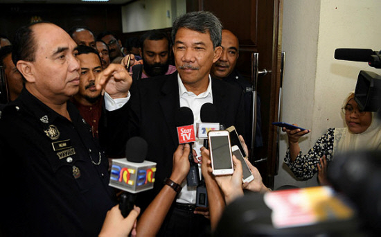 Datuk Seri Mohamad Hasan speaks to the media at the court today.